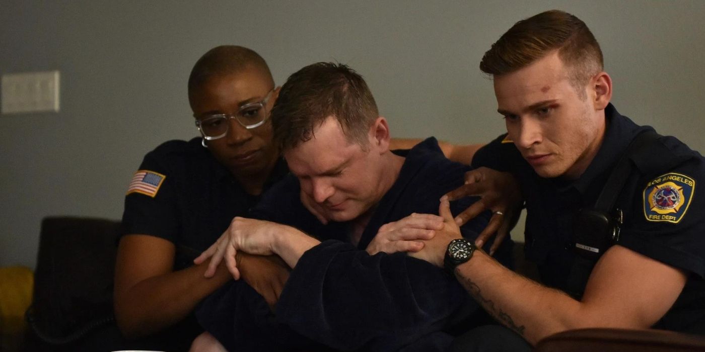 Aisha Hinds as Henrietta Wilson and Oliver Stark as Evan Buckley sit on either side of Peter Krause as Bobby Nash on 9-1-1