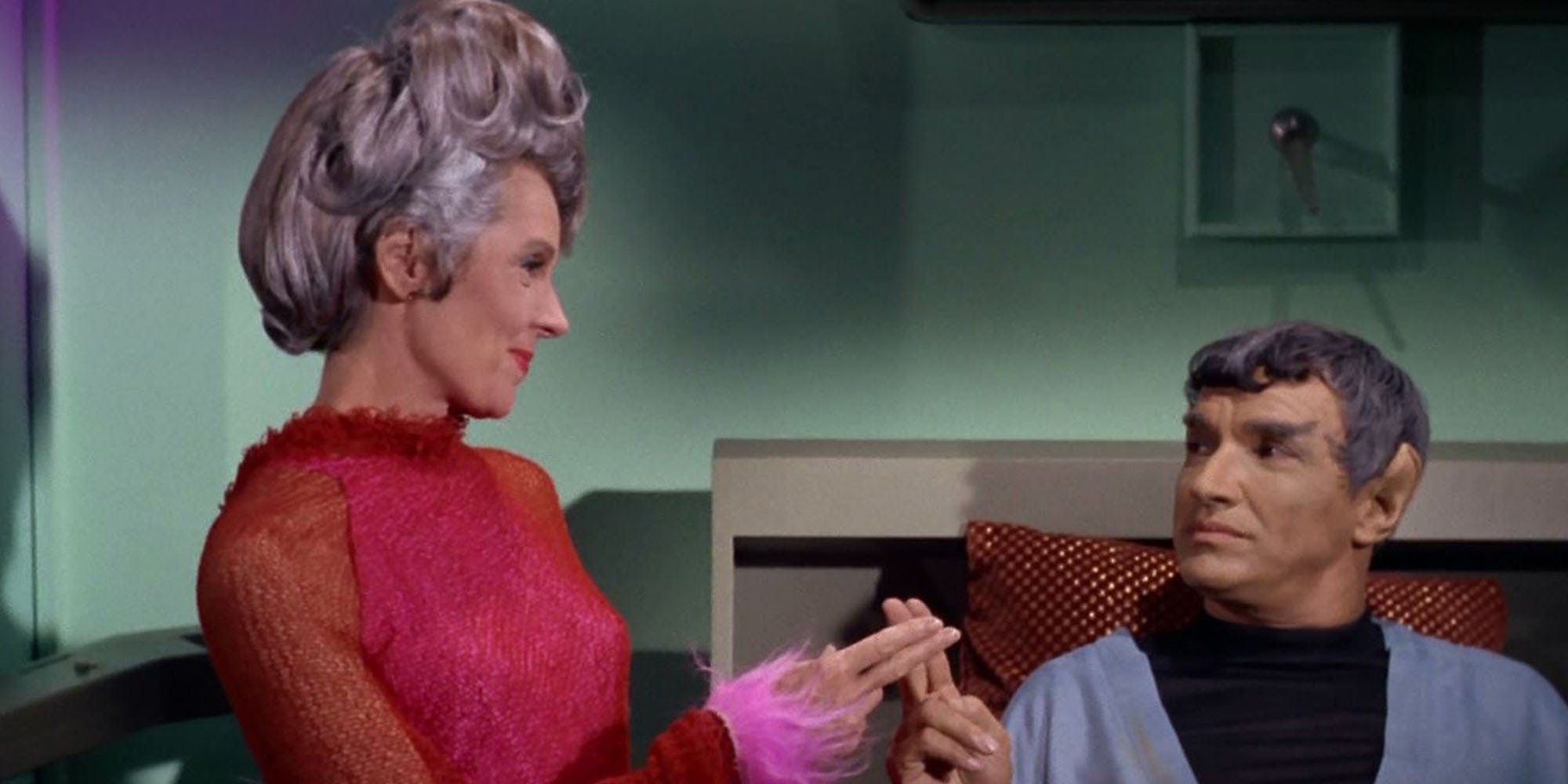 Amanda and Sarek in a biobed touching fingers from STar Trek the Original Series