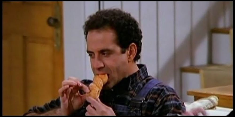 Antonio Scarpacci, played by Tony Schalhoub, eats a croissant on Wings