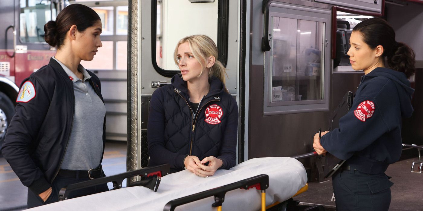 Stella, Brett and Violet stand around a gurney by Ambulance 61 in Chicago Fire Season 12 premiere