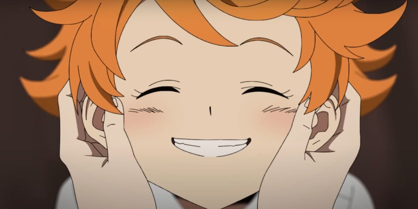 Emma smiles while blushing while her mother holds her face