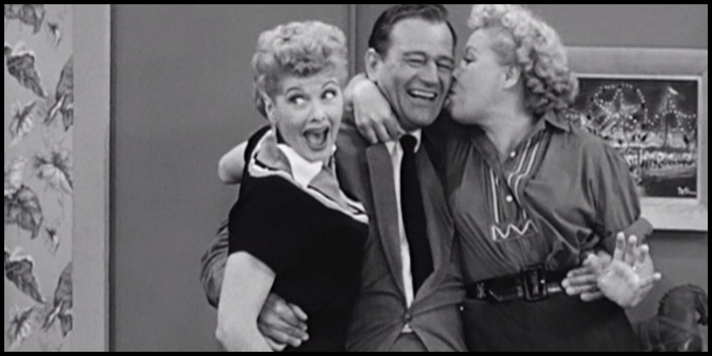 Lucy and Ethel hug John Wayne in "Lucy and John Wayne" from I Love Lucy