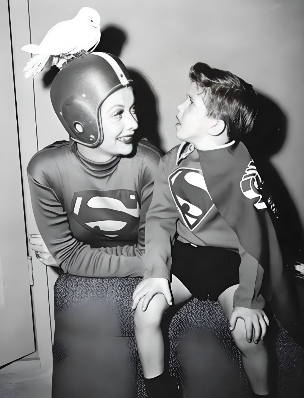 Lucy and Little Ricky wearing Superman costumes
