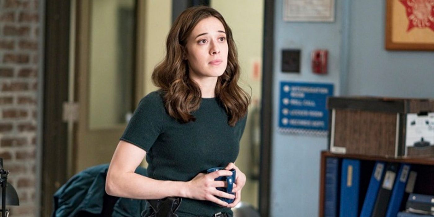 Marina Squerciati as Kim Burgess holds a coffee cup in an office on Chicago P.D.