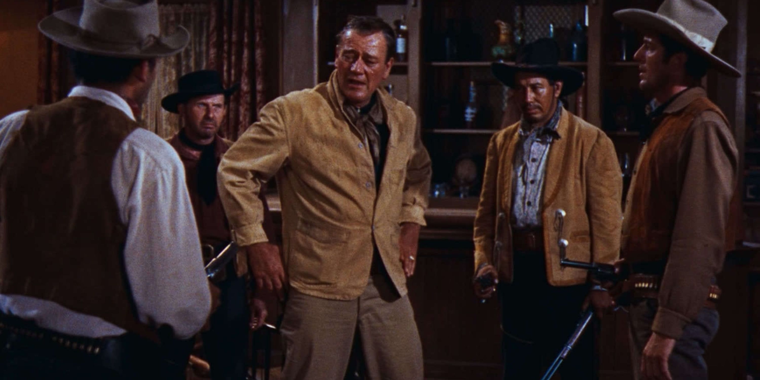 Sheriff John Chance is surrounded by gunfighters in a bar in Rio Bravo