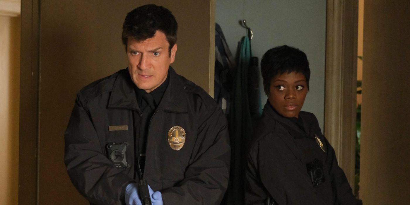 Nathan Fillion as John Nolan enters a room with Afton Williamson as Talia Bishop on The Rookie