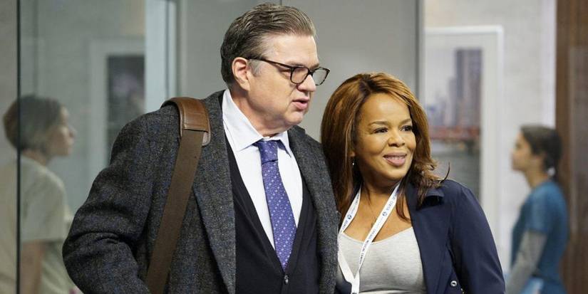 Oliver Platt as Daniel Charles stands with Paula Newsome as Caroline Charles on Chicago Med