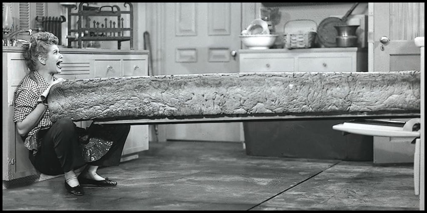 Lucy struggles with a massive loaf of bread in "Pioneer Women" from I Love Lucy