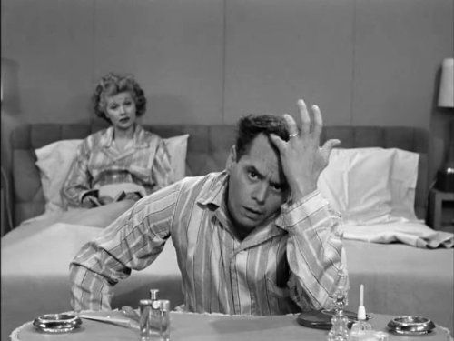 Ricky Ricardo I Love Lucy examining his hairline with Lucy in the background