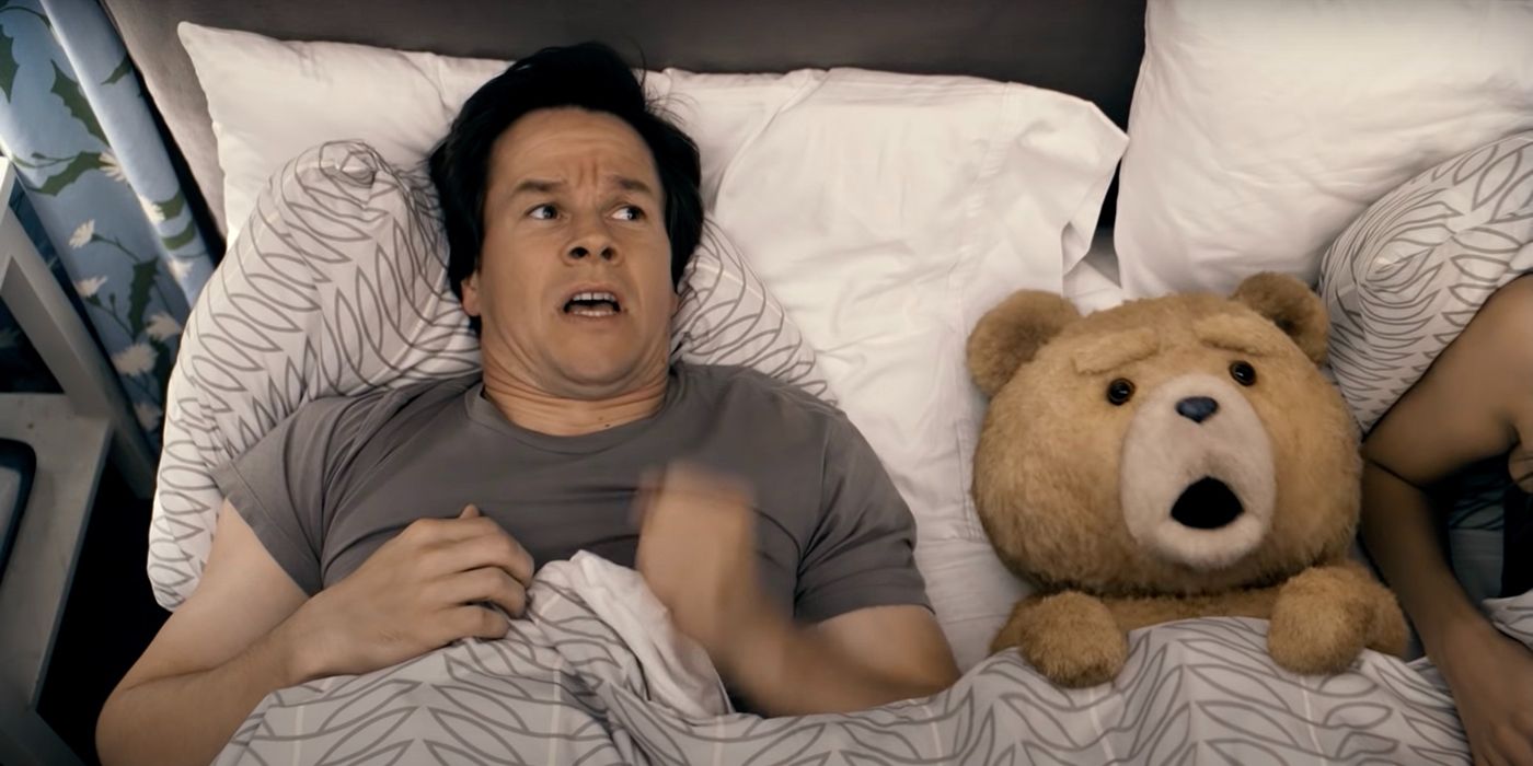 Mark Wahlberg and Ted lying in bed in the movie Ted.