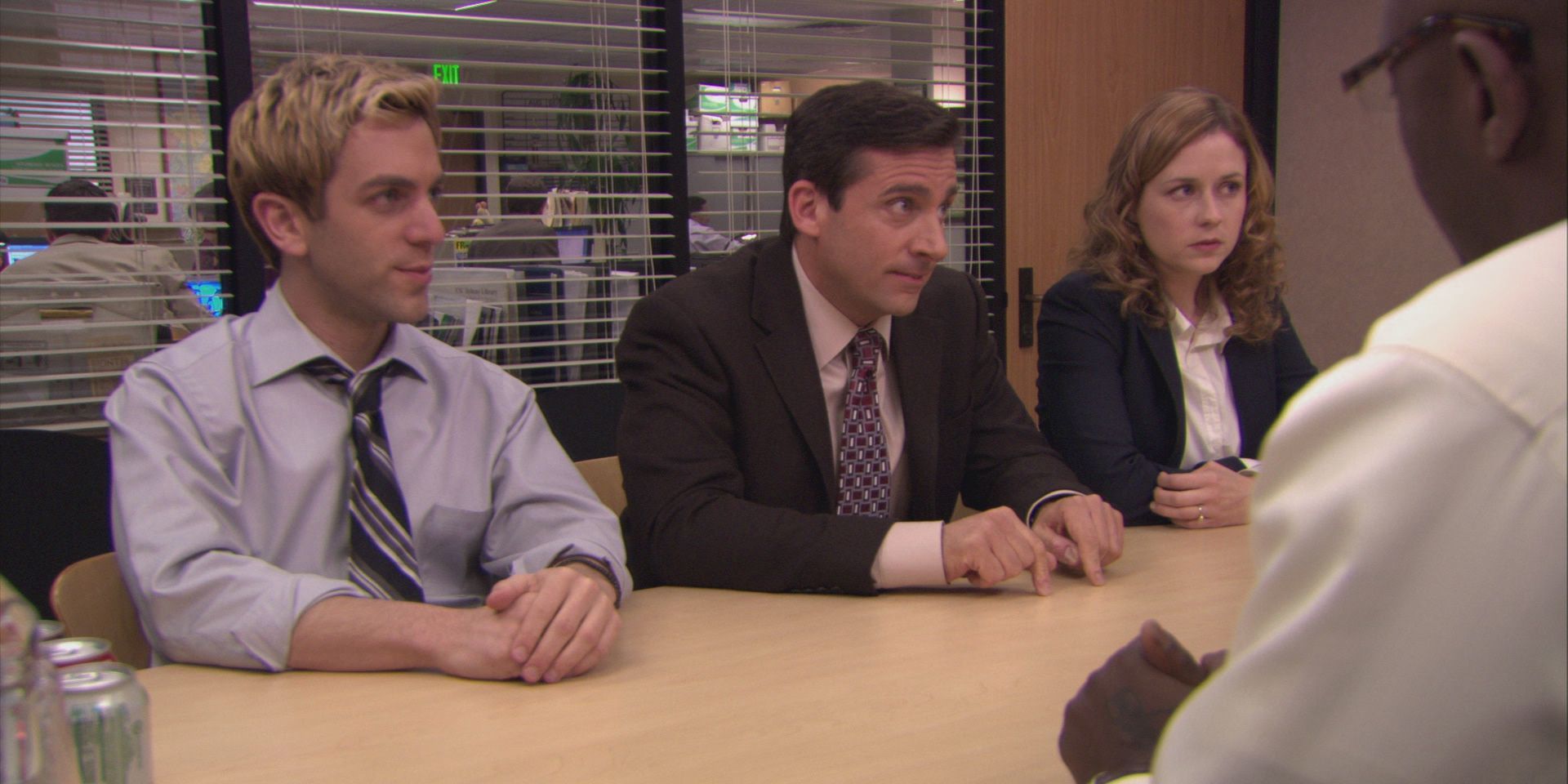 Michael Scott, sitting in between Ryan and Pam, negotiates the sale of his paper company in The Office episode "Broke"