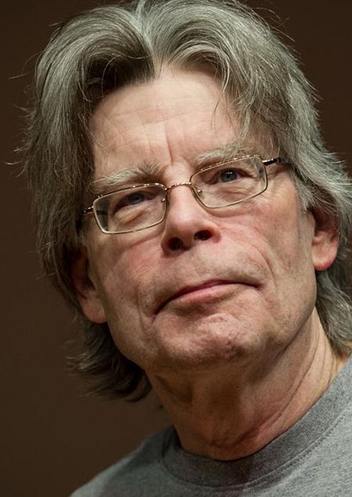 American Author Stephen King against a brown background