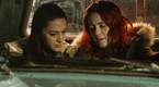 Asta and D'Arcy talk in the truck in Resident Alien