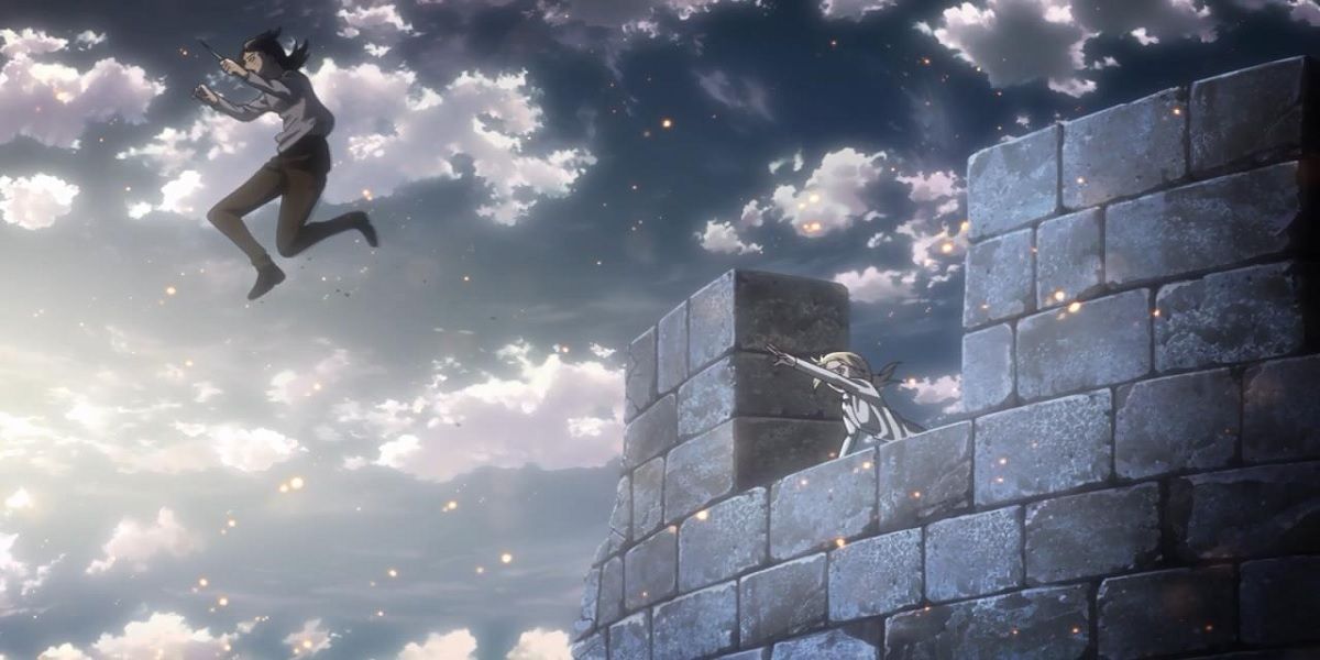 Christa alcançando Ymir enquanto ela pula da torre prestes a se transformar em um Titã de Attack On Titan.