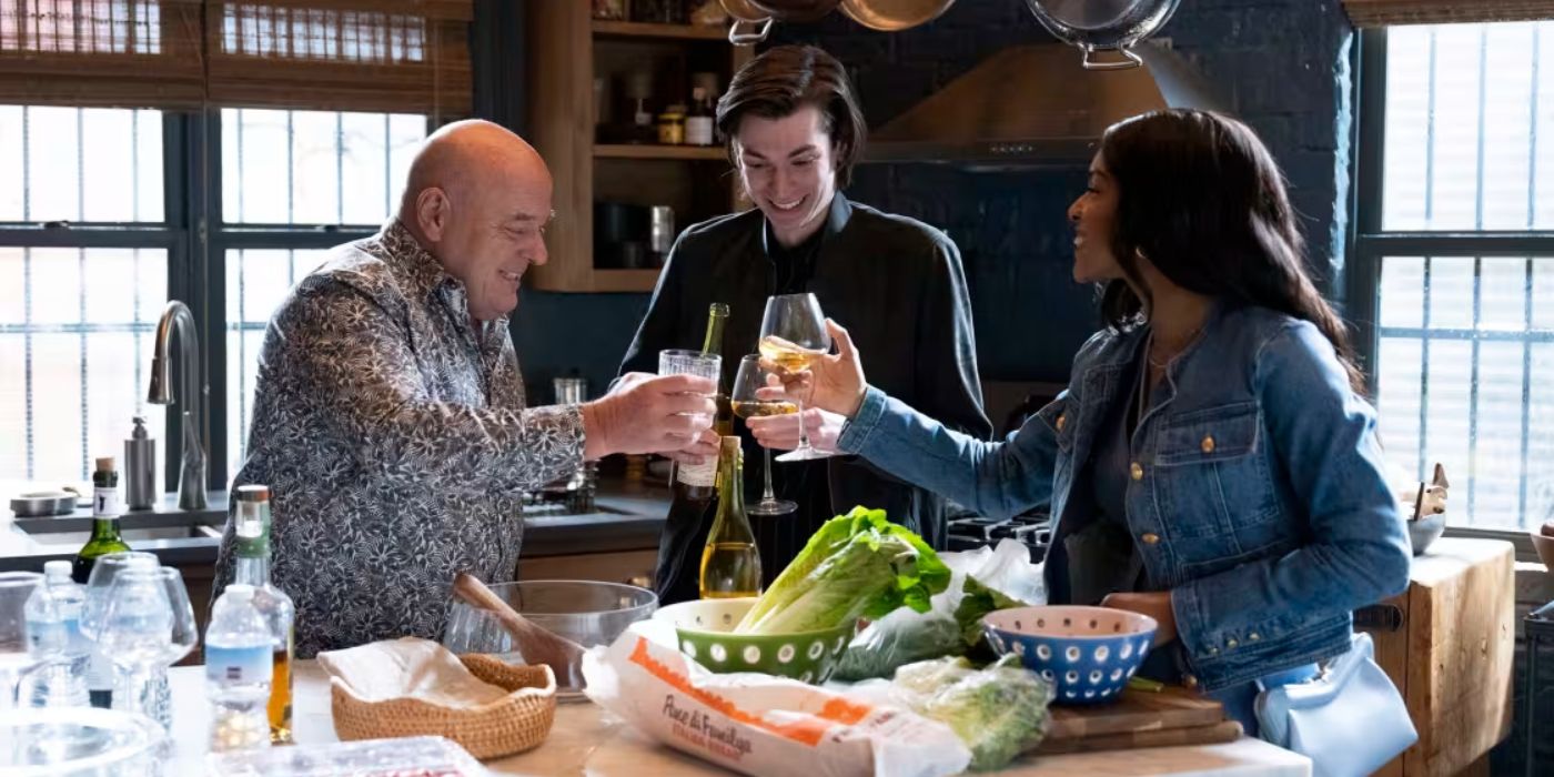 Dean Norris as Randall Stabler clinks drink glasses with Nicky Torchia as Eli Stabler and Kiaya Scott as Becky on Law & Order_ Organized Crime