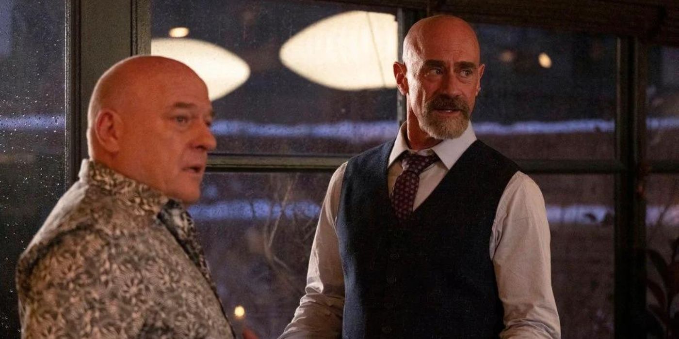 Dean Norris as Randall Stabler stands in front of a window talking to Christopher Meloni as Elliot Stabler on Law & Order_ Organized Crime