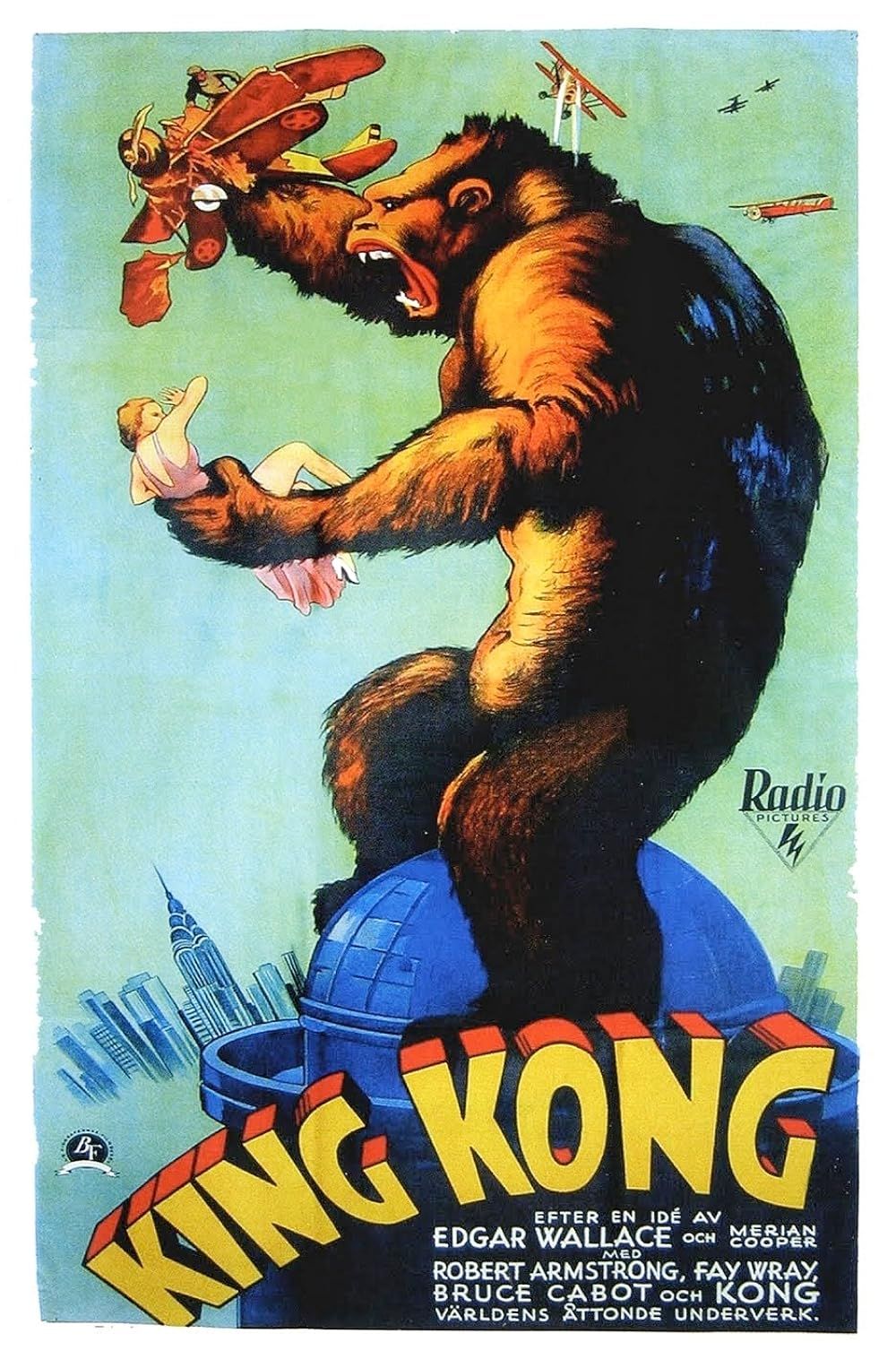 In an illustrated image, King Kong holds onto Fay Wray while destroying a plane.