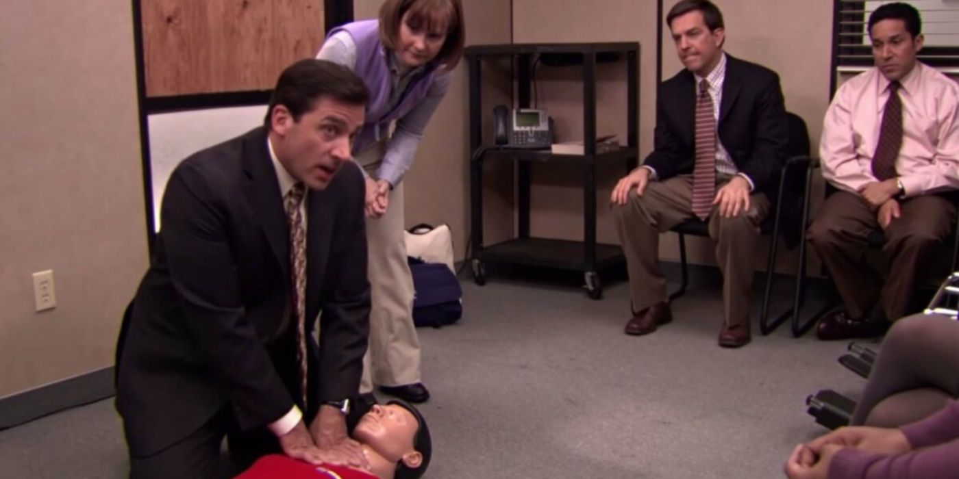 Michael learning CPR on a dummy in The Office