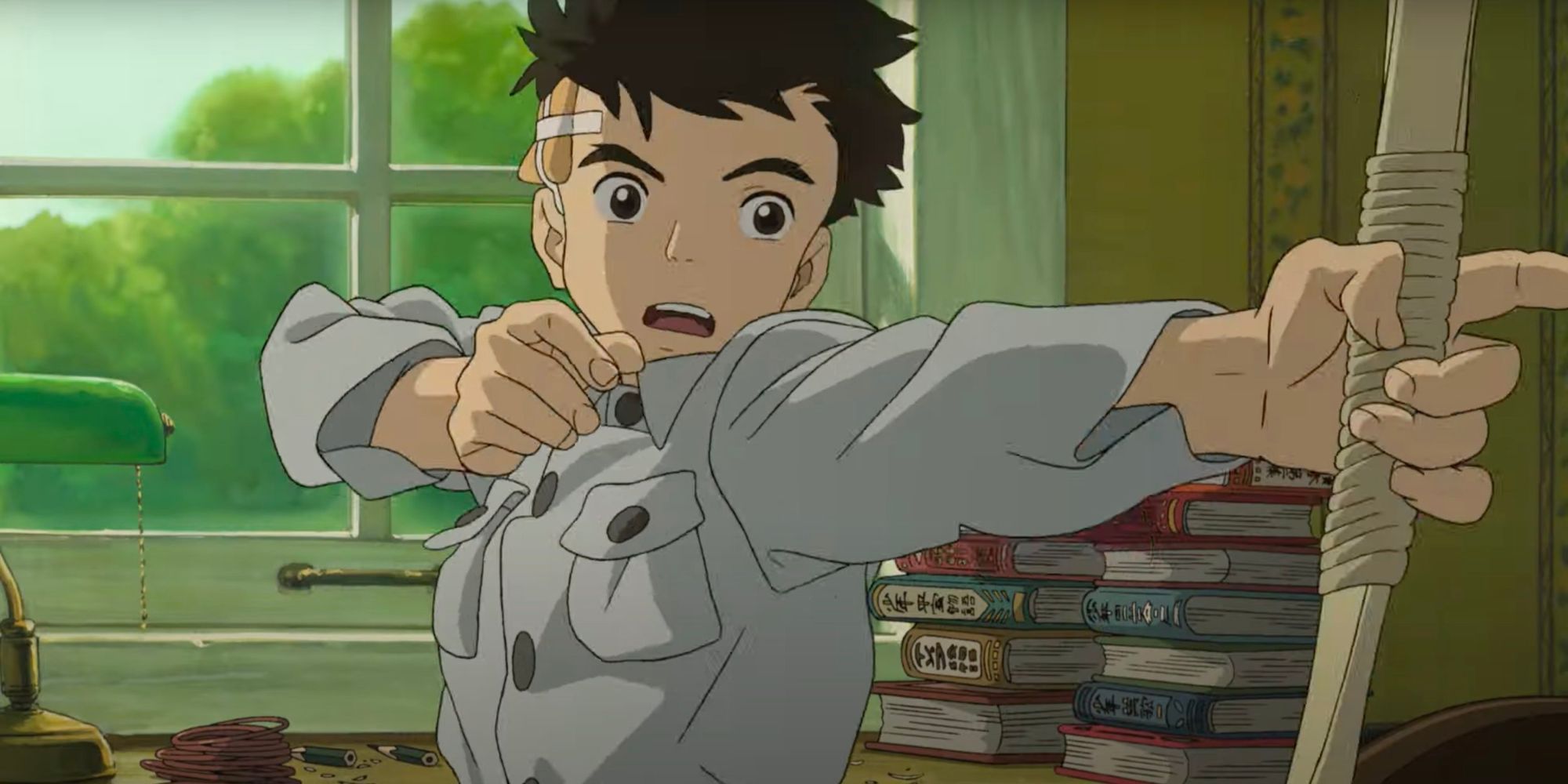Mahito practices his archery pose in Studio Ghibli's The Boy and The Heron