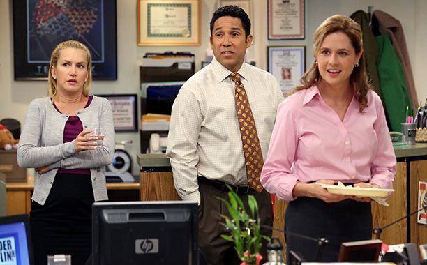 Pam and Oscar looking happy with Angela next to them who looks concerned in The Office