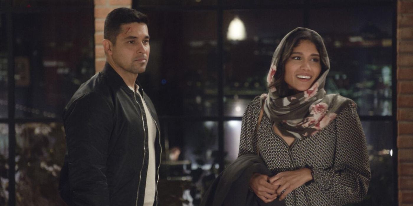 Wilmer Valderrama as Nick Torres stands with Anisha Adusumilli as Veeda Rajab on NCIS