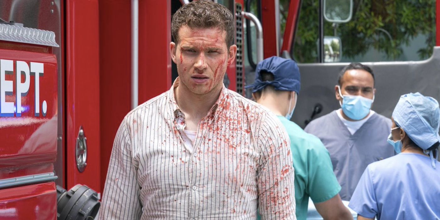 Evan Buckley (Oliver Stark) covered in blood with doctors behind him on 9-1-1