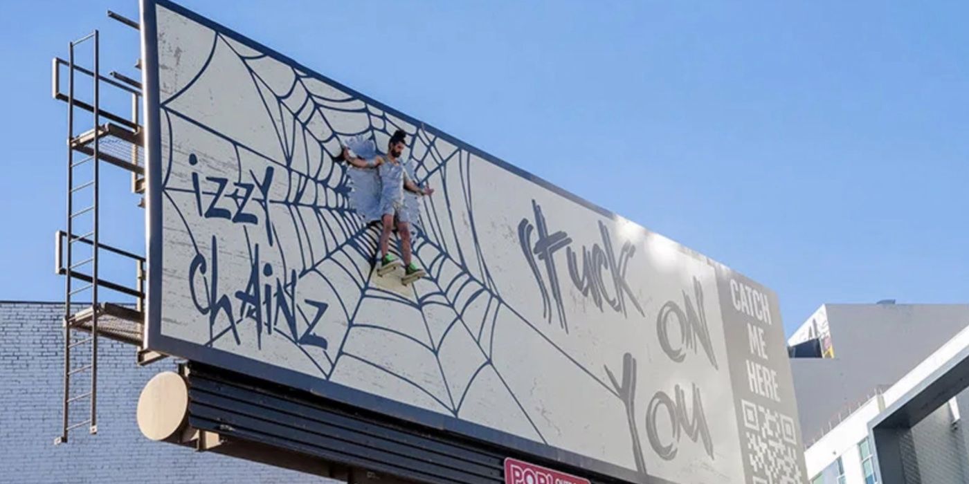 Izzy Chains duck taped on a billboard promoting his music on 9-1-1