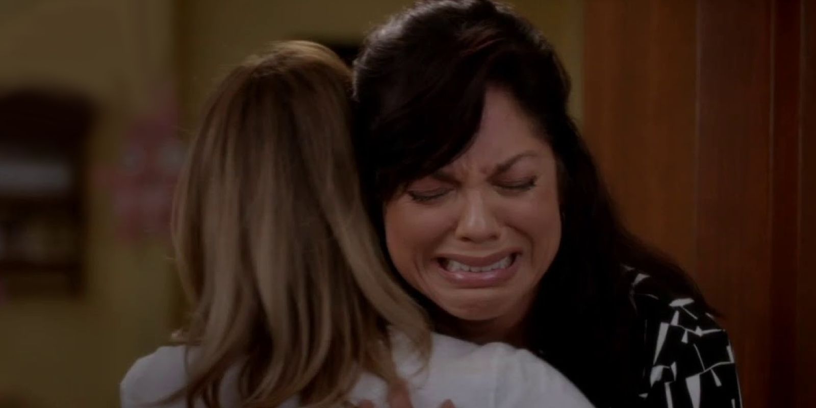 Callie sobbing into Meredith's arms in Grey's Anatomy