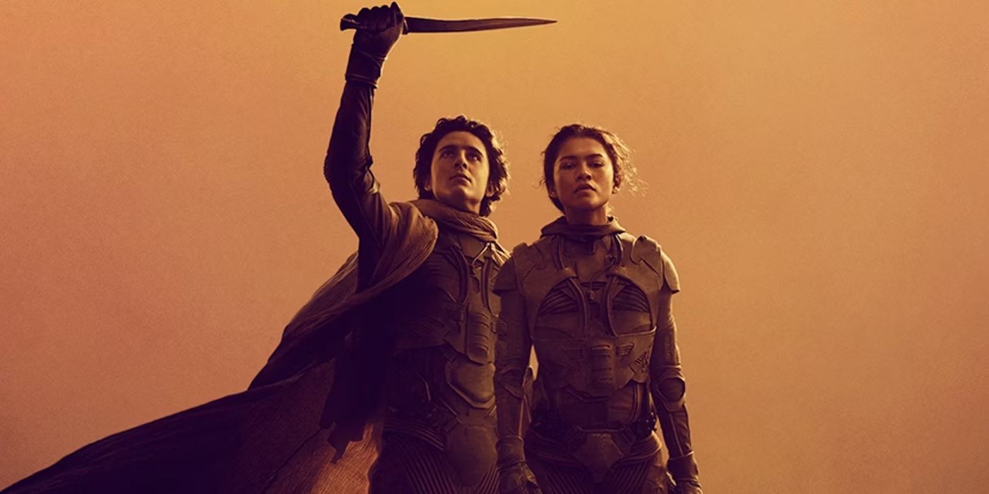 Paul Atreides holding a crysknife and Chani standing against a dusty orange background in Dune: Part Two.