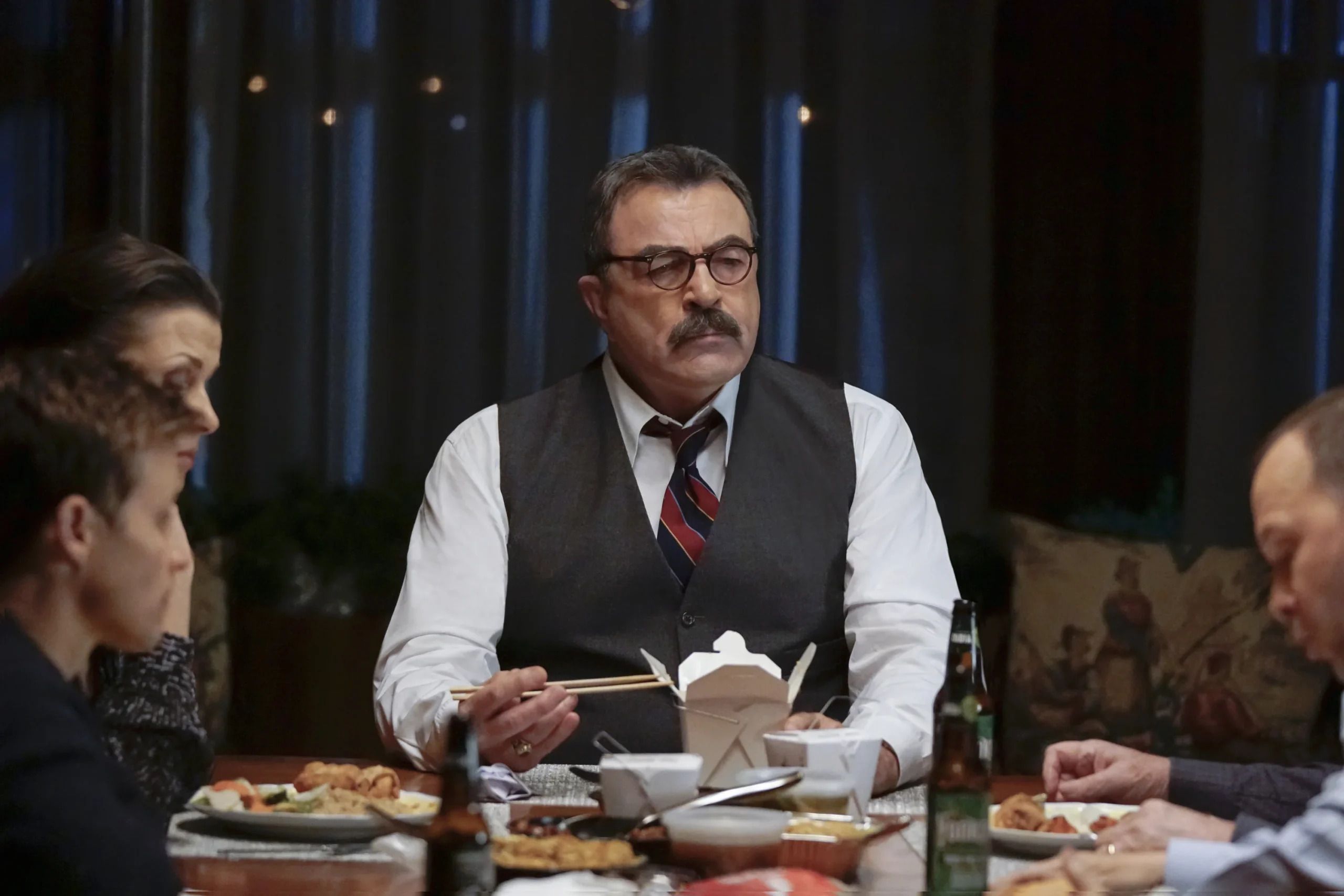 Frank Reagan sits at the dinner table in Blue Bloods