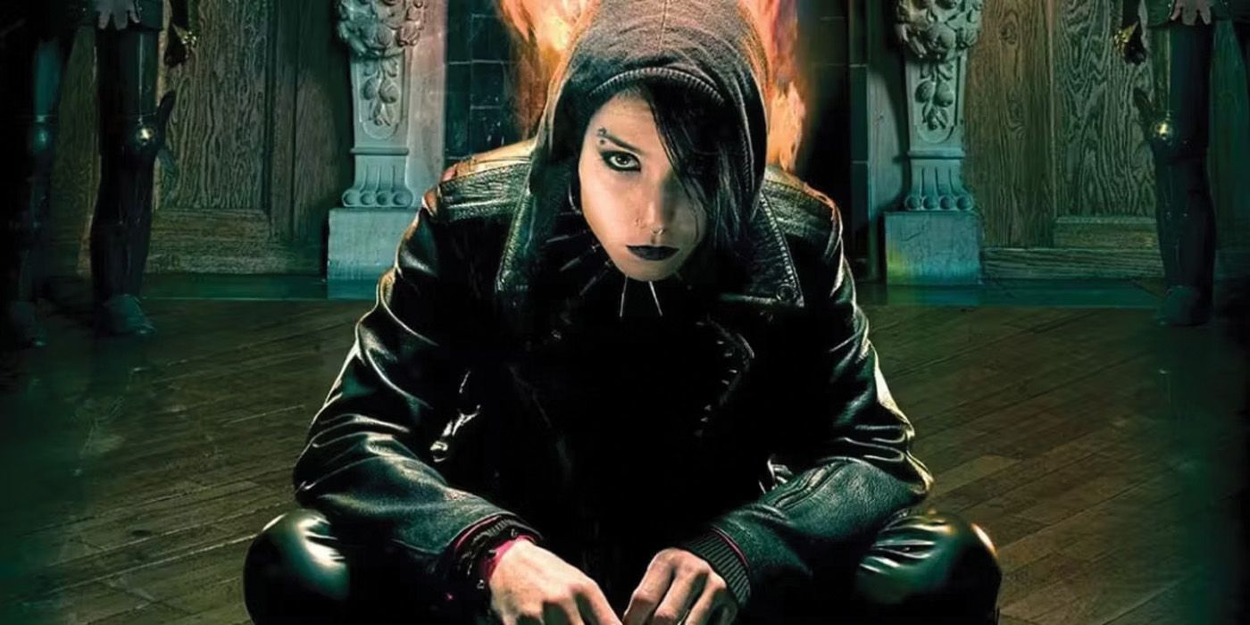Girl With the Dragon Tattoo's Lizbeth Salander crosslegged in front of fire.
