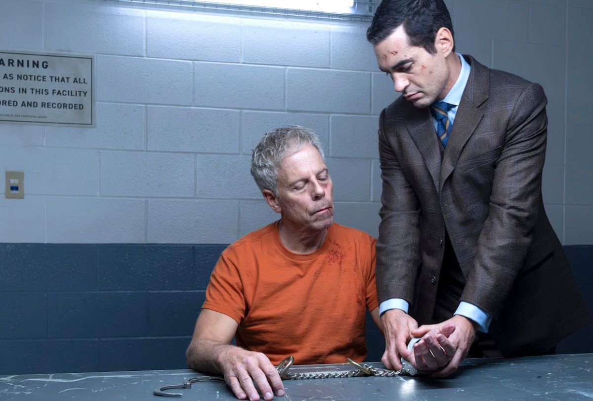 Greg Germann as James Ulster with Ramon Rodriguez as Will Trent in an interrogation room