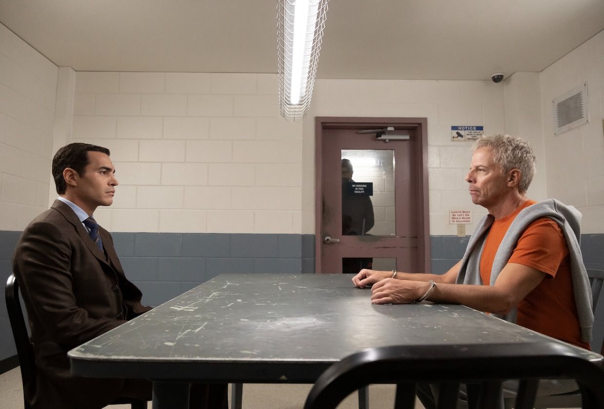 Greg Germann as James Ulster with Ramon Rodriguez as Will Trent looking at each other in an interrogation room