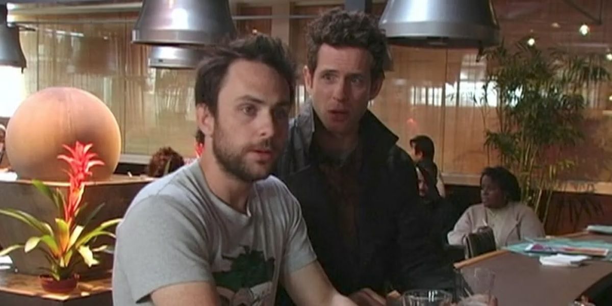 Dennis looking shocked at Charlie as he reads a door marked private as pirate in It's Always Sunny In Philadelphia.