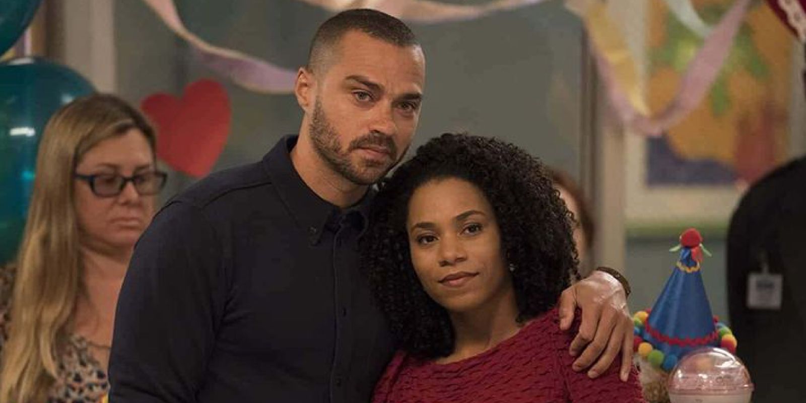 Maggie Pierce cuddled against Jackson Avery's shoulder in Grey's Anatomy.