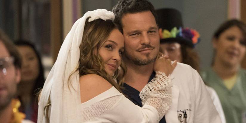 OJ wearing a wedding dress costume and hugging Alex in Grey's Anatomy