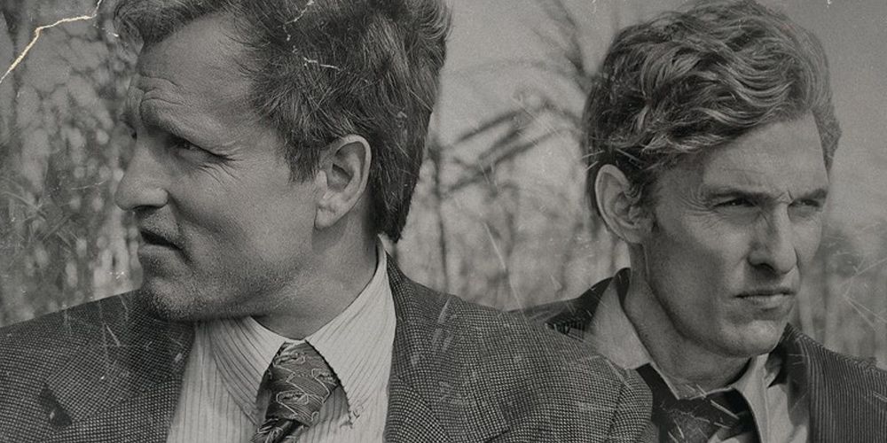 Marty and Rust walk through the field in True Detective
