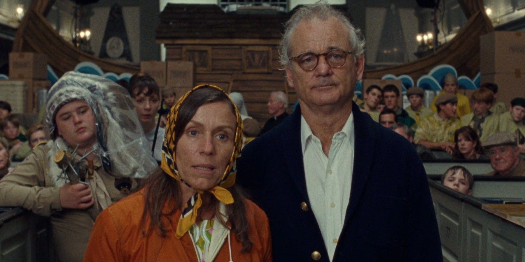 Frances McDormand and Bill Murray stand in the campground in Moonrise Kingdom.