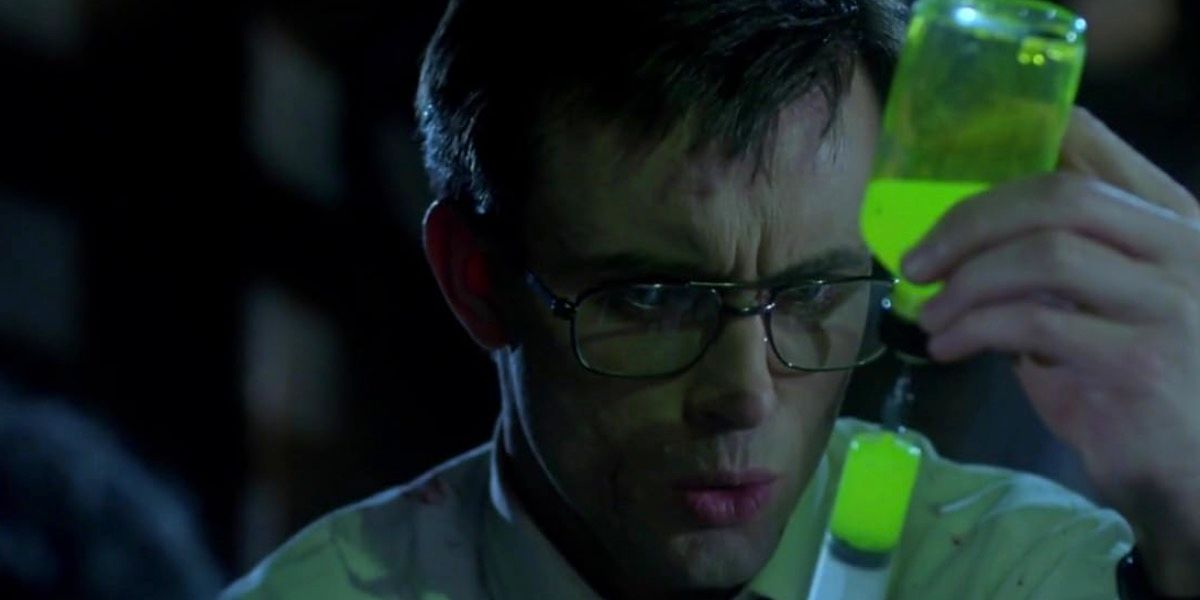 Herbert West filling his glowing concoction in a syringe in Re-Animator