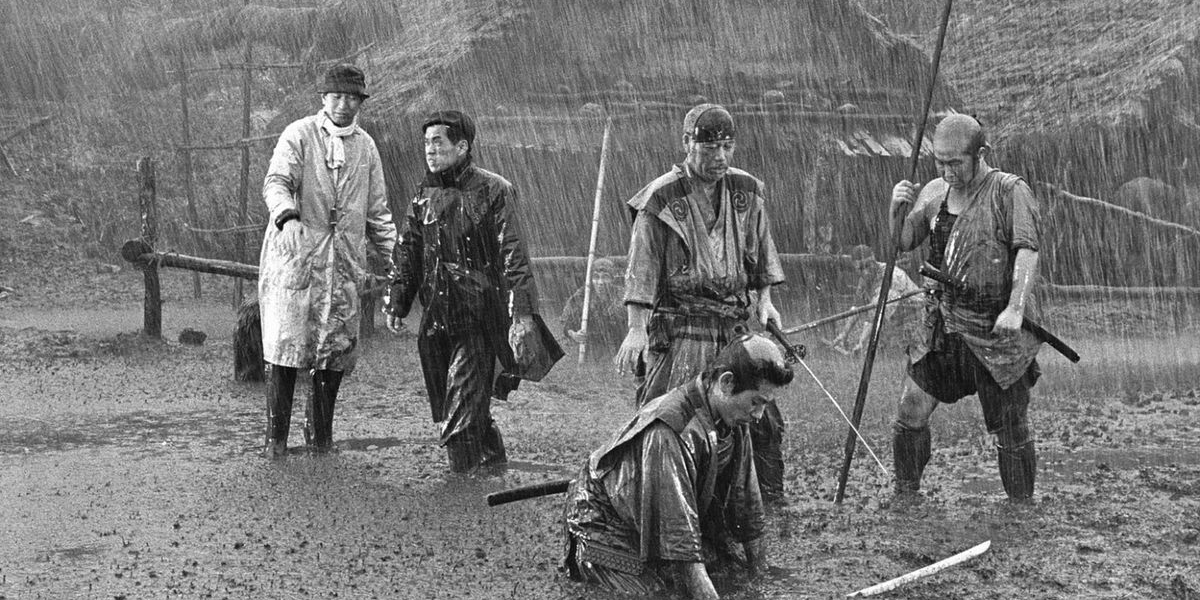 Akira Kurosawa directing three actors in the rain in Seven Samurai