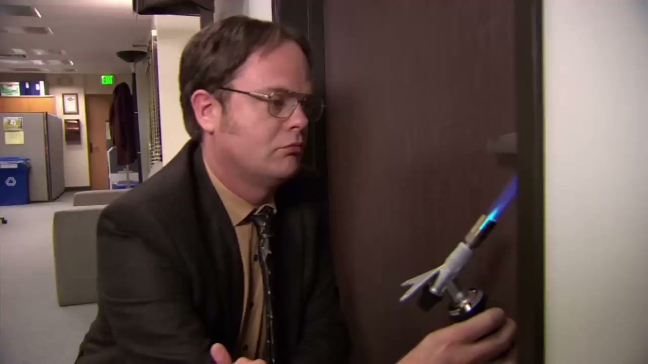 Dwight heating a doorknob in The Office