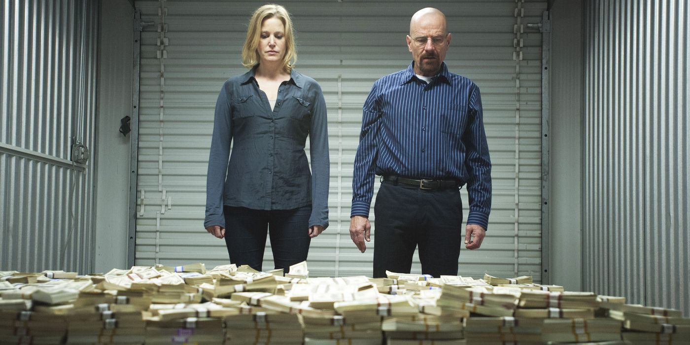 Skyler and Walter White looking at Walt's massive pile of drug money in a storage unit