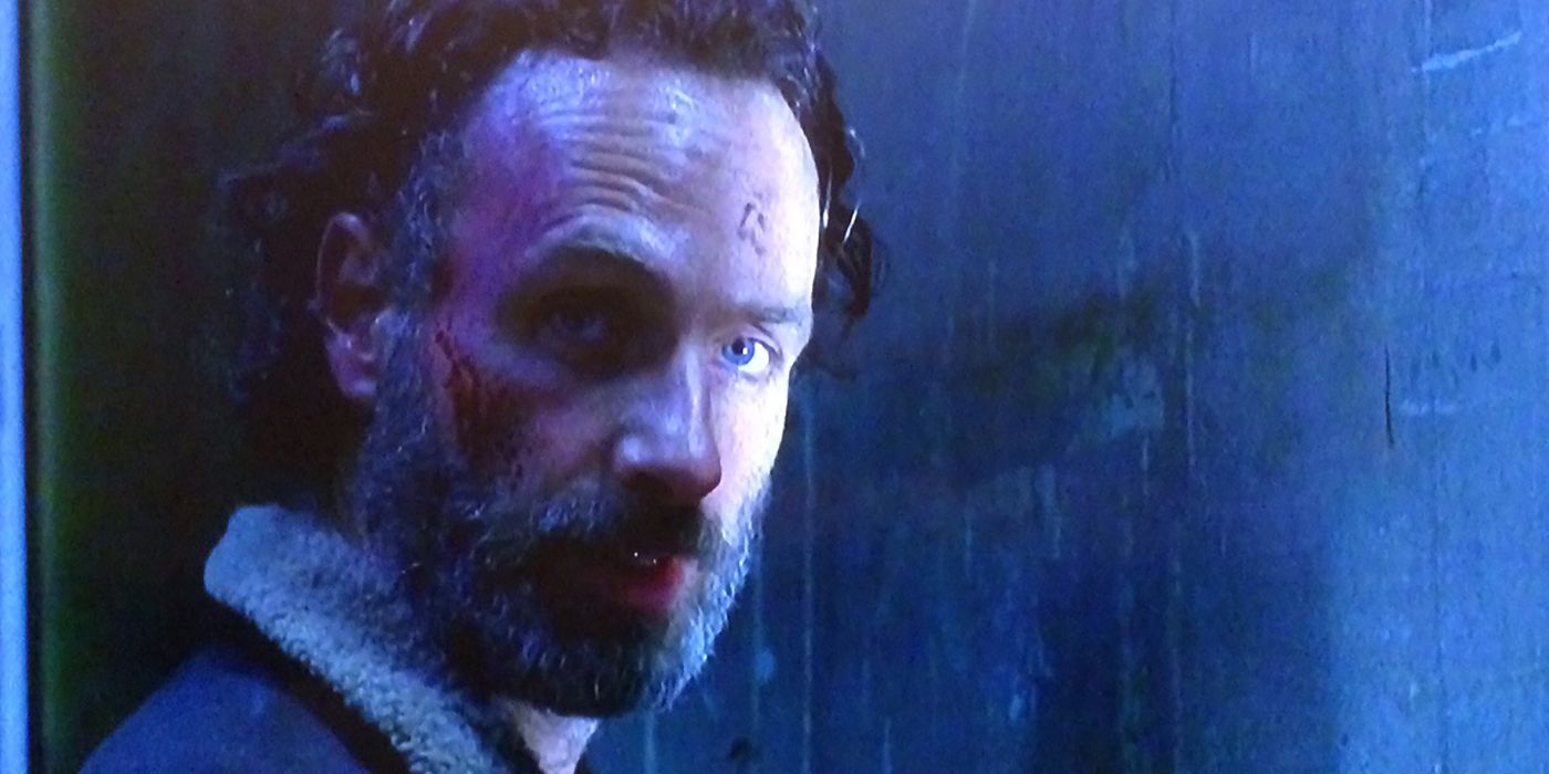 Rick under a blue light looking menacing in The Walking Dead