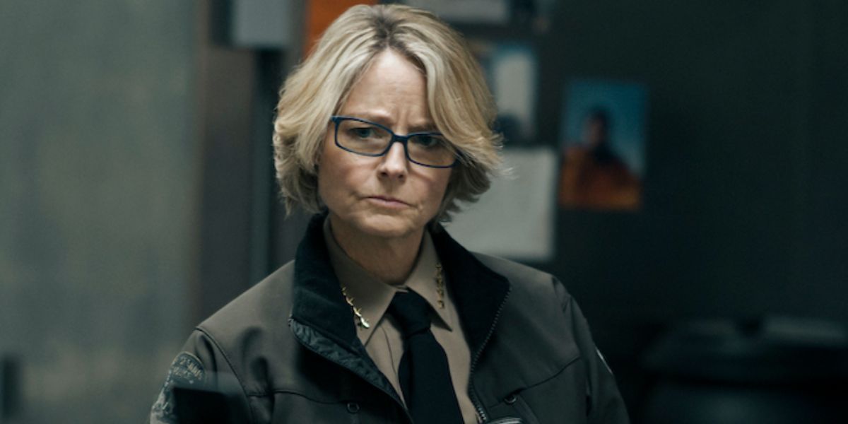 Liz Danvers (Jodie Foster) looking perplexed as she examines evidence in True Detective: Night Country
