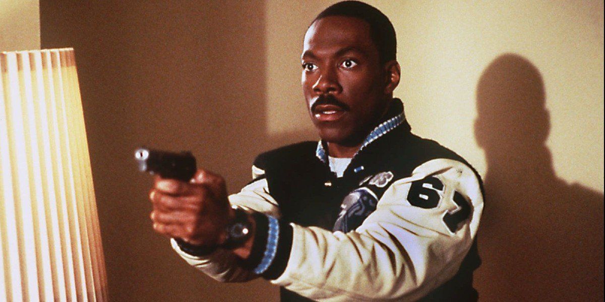 Eddie Murphy aiming a gun in Beverly Hills Cop
