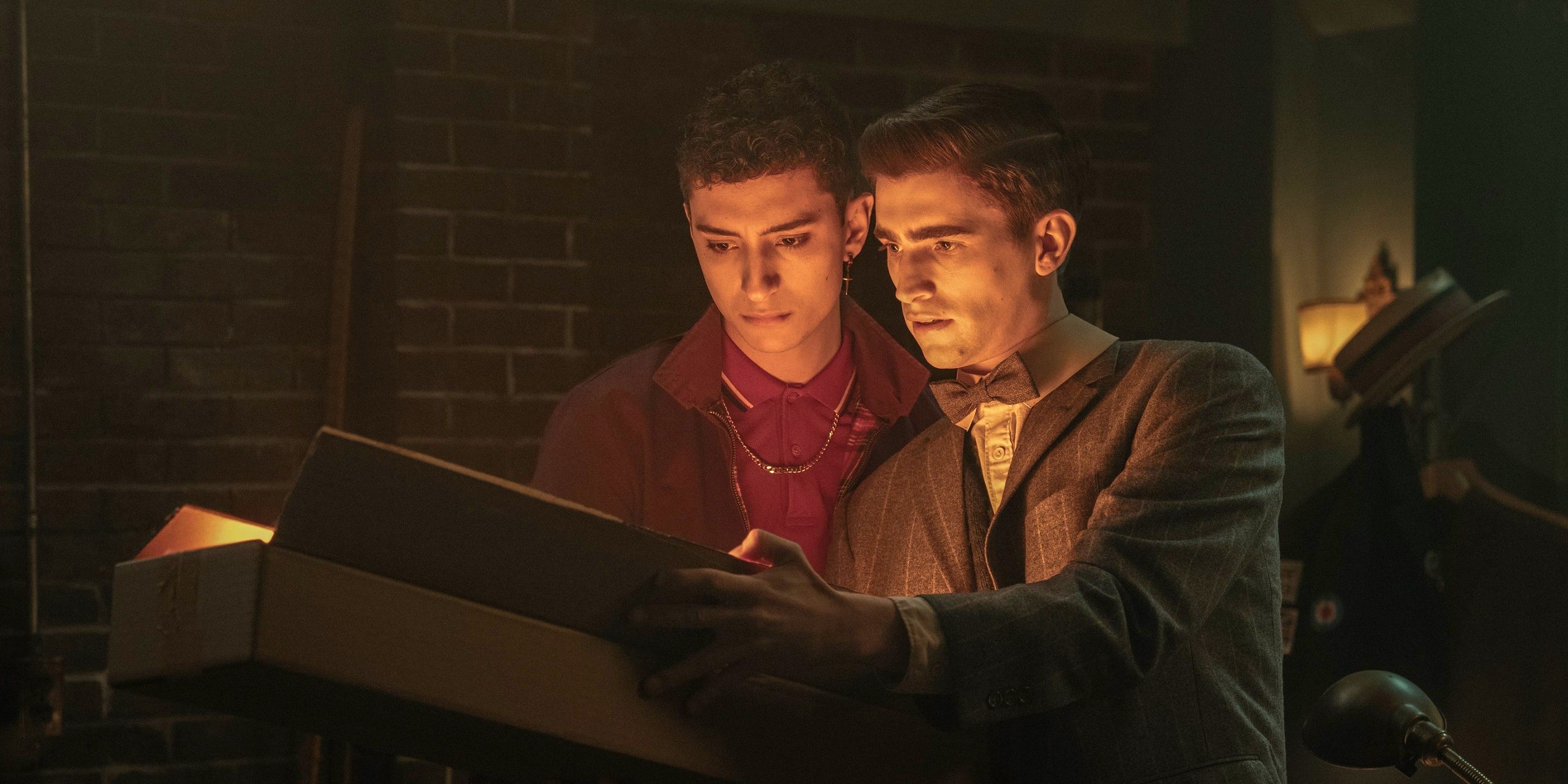 Charles and Edwin reading a glowing book in Dead Boy Detectives.