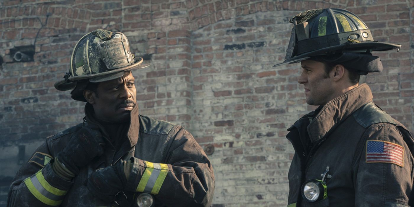 Boden (Eamonn Walker) and Casey (Jesse Spencer) standing outside of a building in Chicago Fire "Deathtrap"