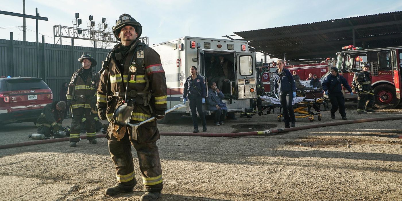 Joe Minoso as Firefighter Joe Cruz with his team looking up at a rescue scene in Chicago Fire episode "My Miracle"