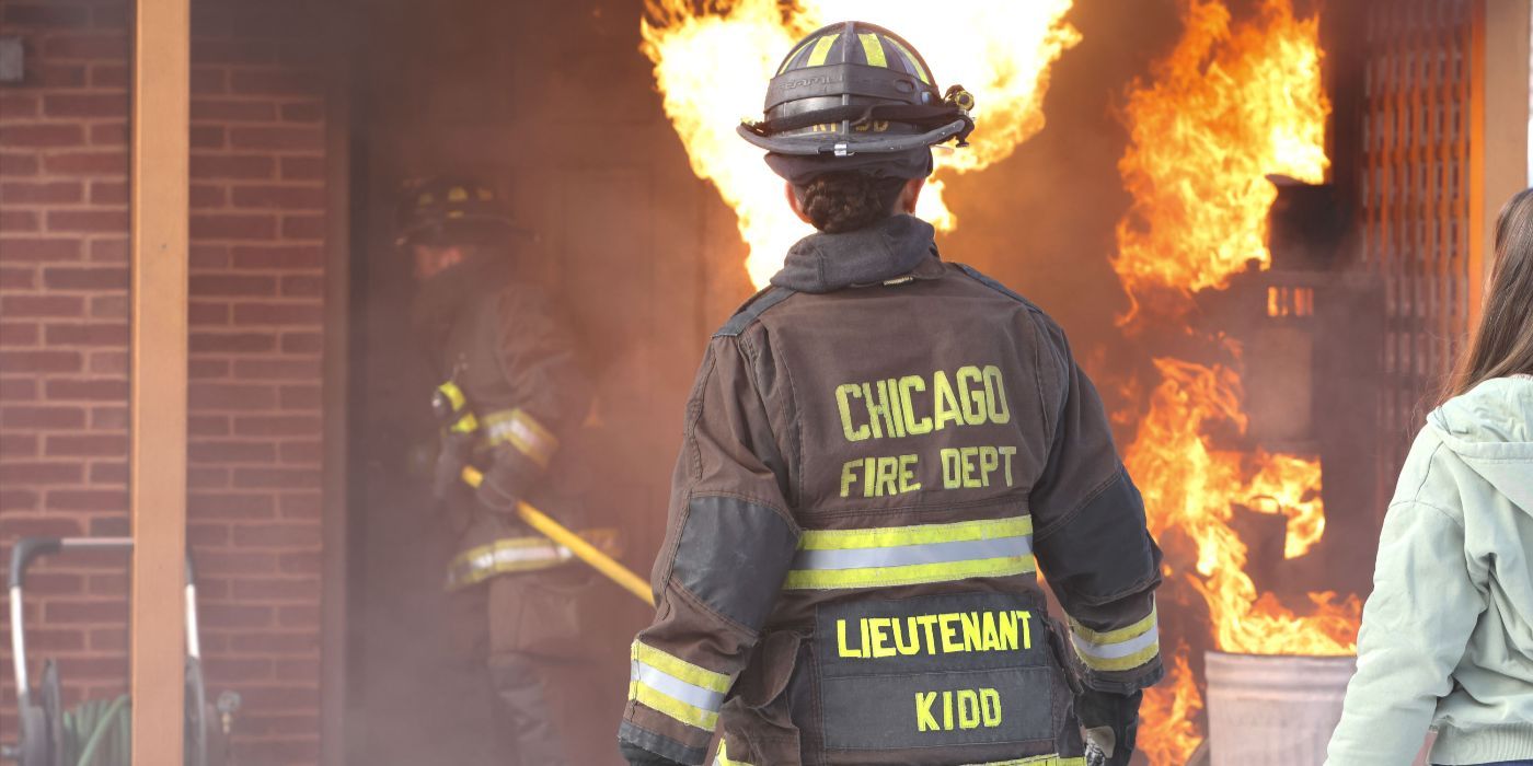 Stella Kidd (actor Miranda Rae Mayo) seen from rear in uniform in front of fire on Chicago Fire