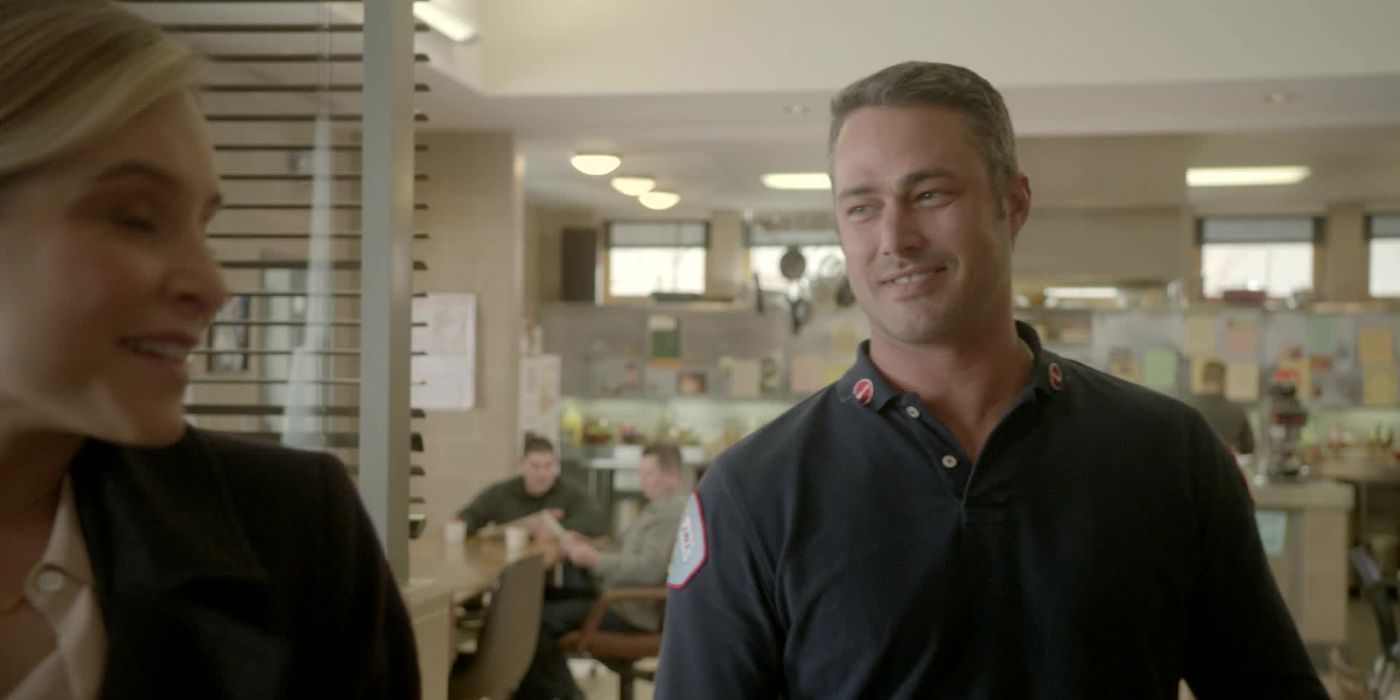 Kelly Severide (Taylor Kinney) talking to a woman in the firehouse in Chicago Fire episode "The Last One For Mom"